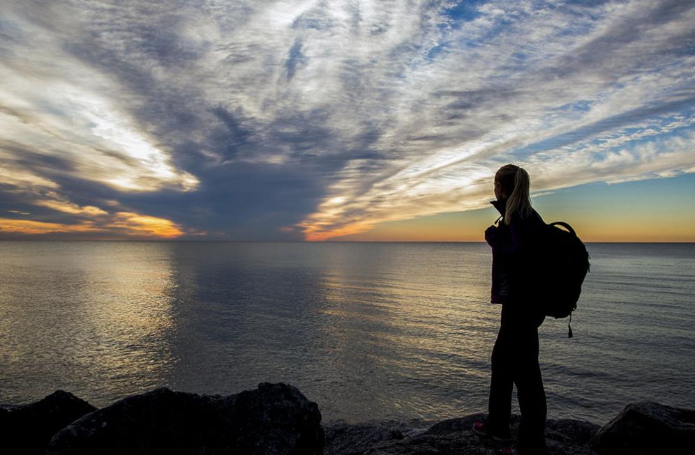 A student takes in the view of Lake Michigan.