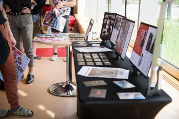 A photo from the 2022 Art Walk, in which Carthage students who major in graphic design, display t...